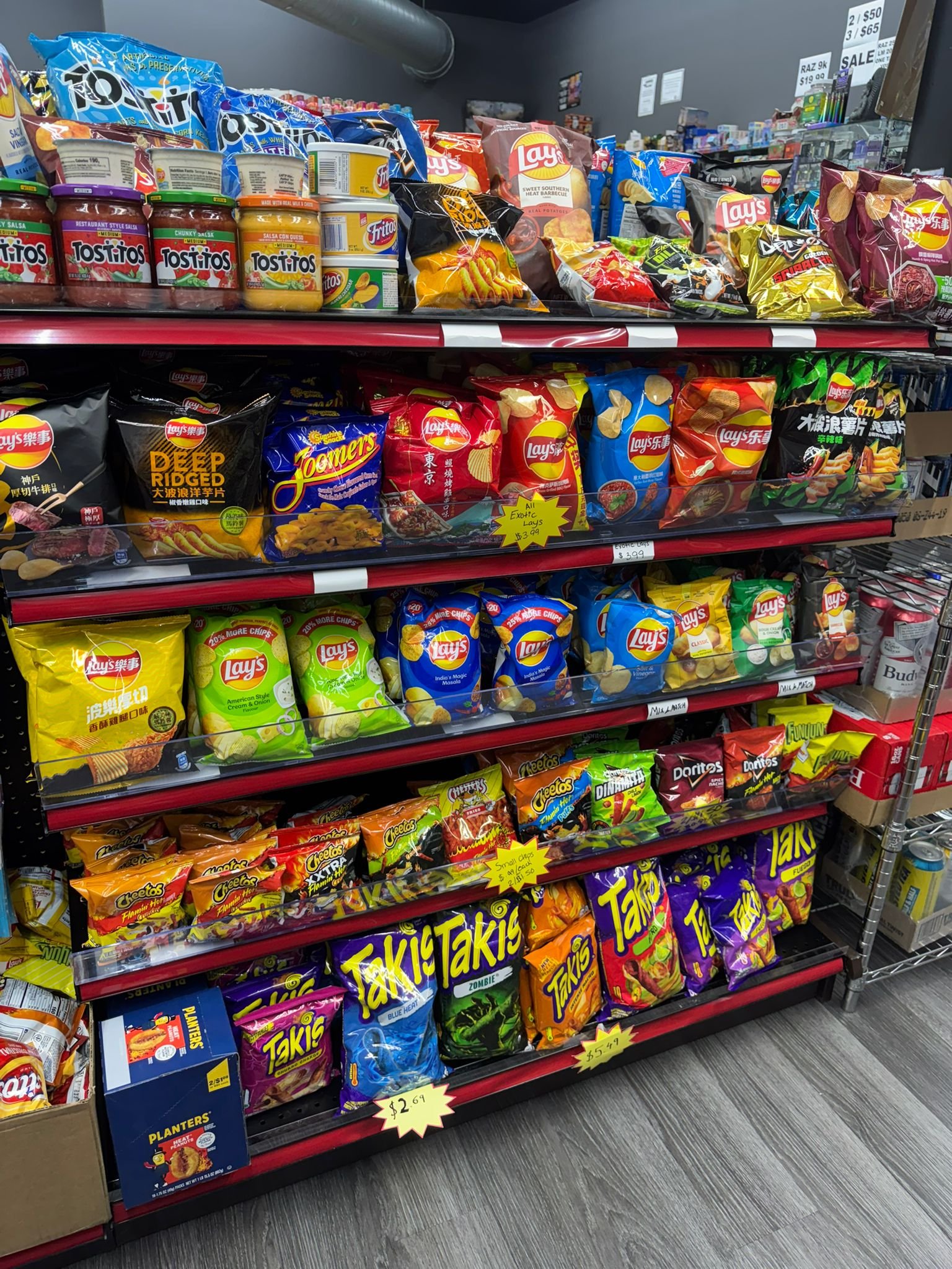 Chips snacks aisle Local Store St Petersburg convenience store — Takis Doritos Lays